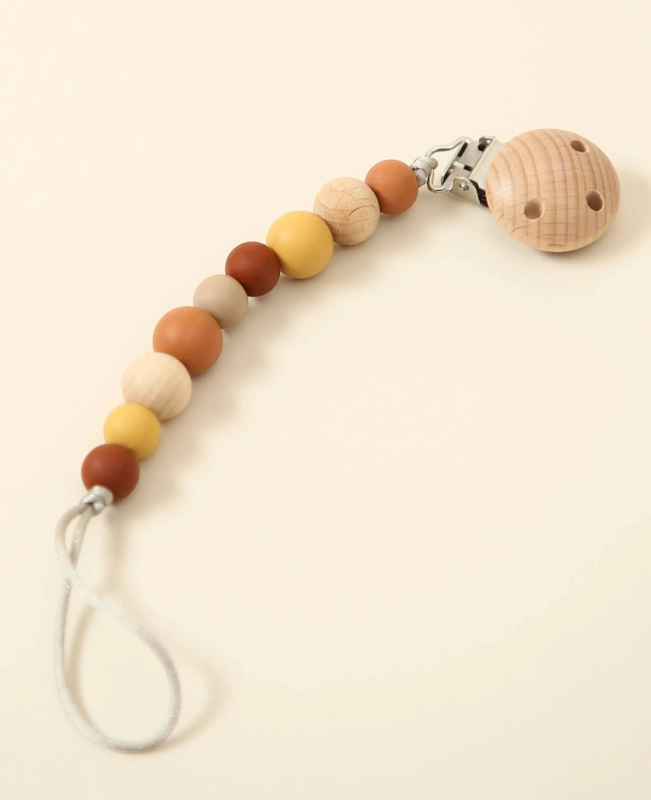 Nuggikette / Schnullerkette "Sienna" in Gelb- /Rottönen, aus Holz und Silikon, 23 cm